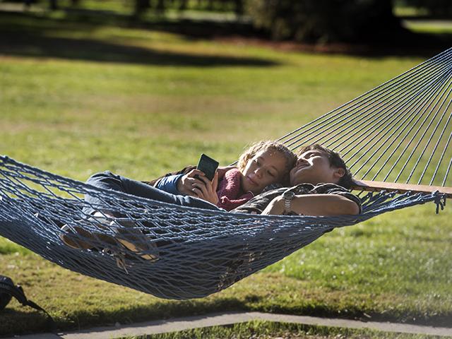 couple snuggling in hammock