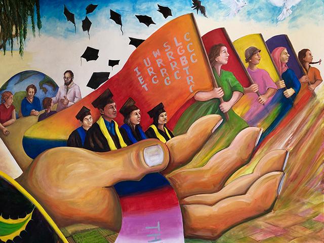 A portion of the mural in front of the Student Community Center