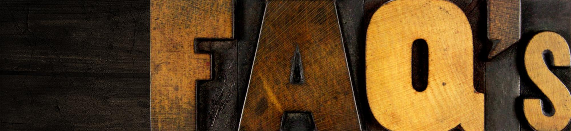the word 'FAQs' spelled in vintage wood blocks