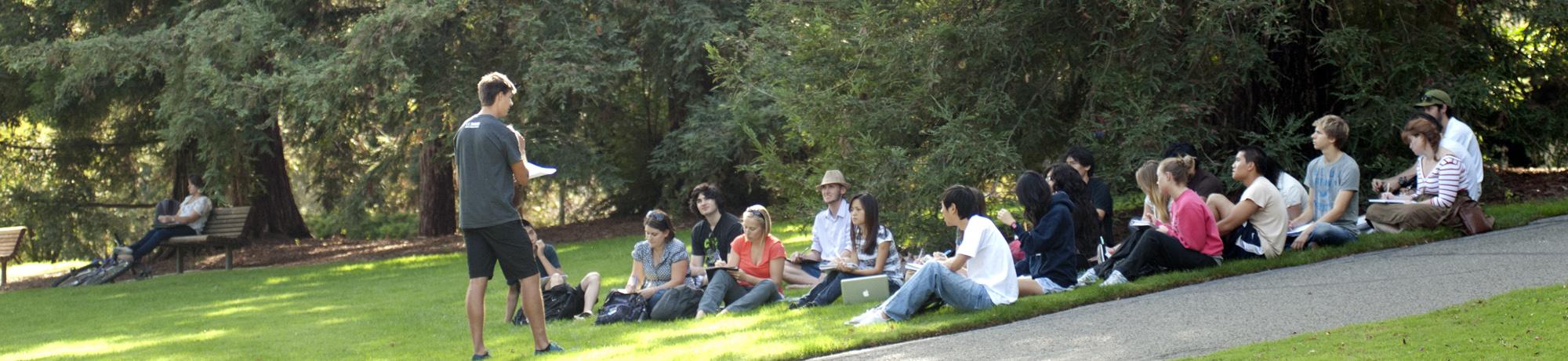 instructor teaching a class in the arboretum